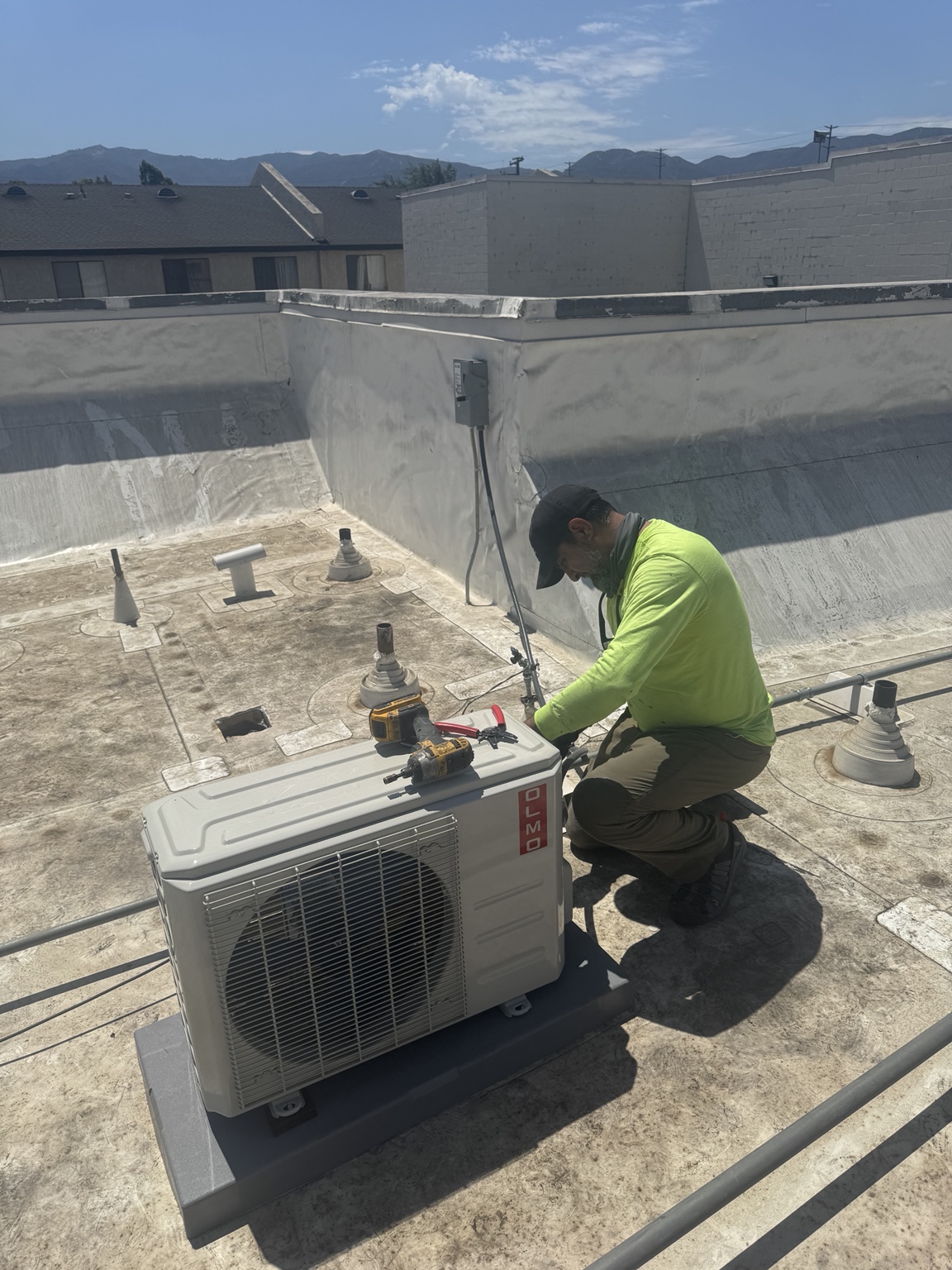 WAIS technician working on rooftop HVAC installation